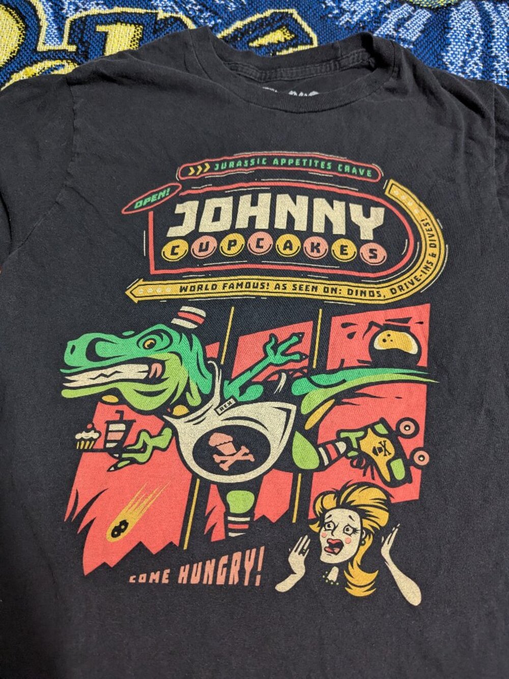 Johnny Cupcakes Dinosaur Jurassic Appetites Crave Black T-Shirt sz Small - Picture 2 of 4